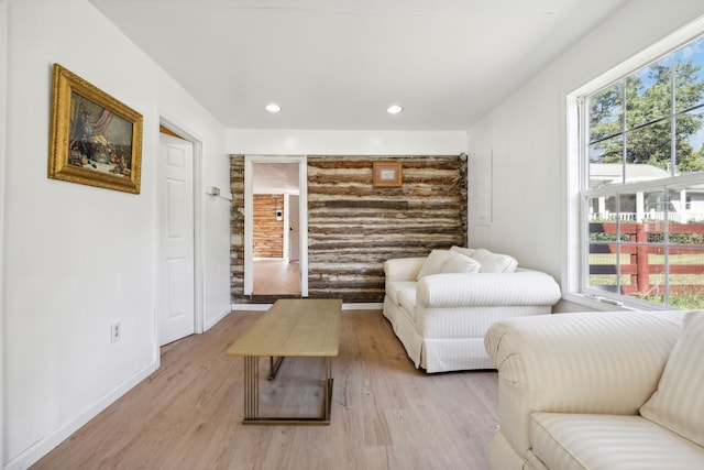 sitting room with light hardwood / wood-style flooring and plenty of natural light