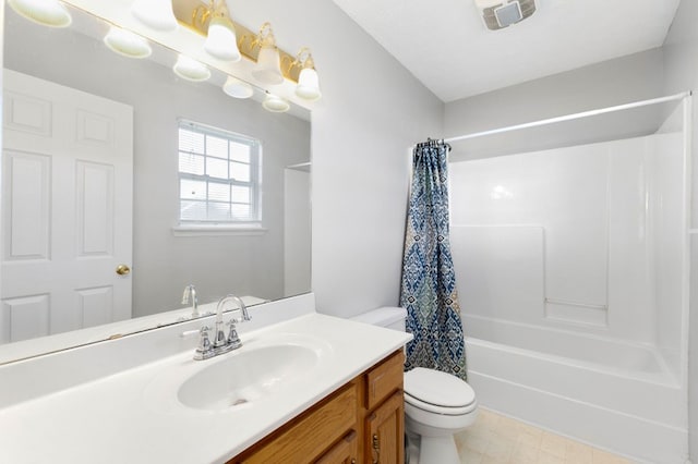 full bathroom featuring shower / tub combo, vanity, and toilet