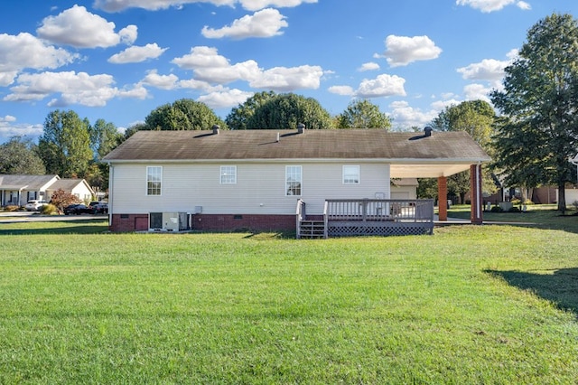 rear view of property with central air condition unit, a yard, and a wooden deck