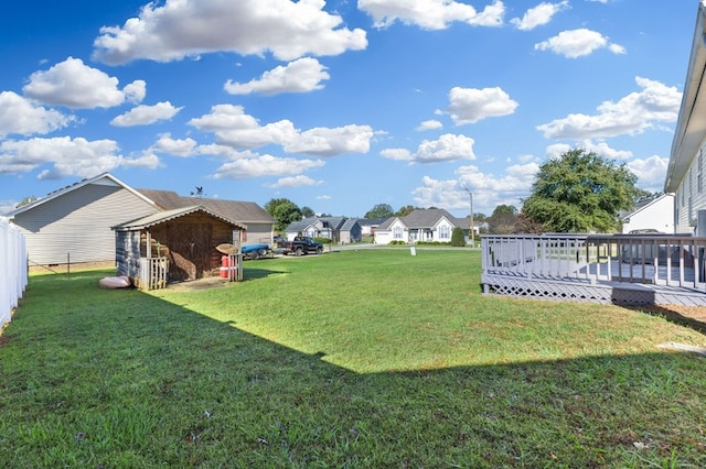 view of yard with a wooden deck