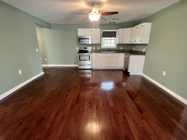 kitchen featuring ceiling fan, white cabinets, dark wood-type flooring, sink, and appliances with stainless steel finishes