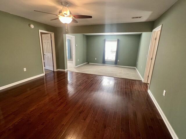 unfurnished room with hardwood / wood-style flooring and ceiling fan