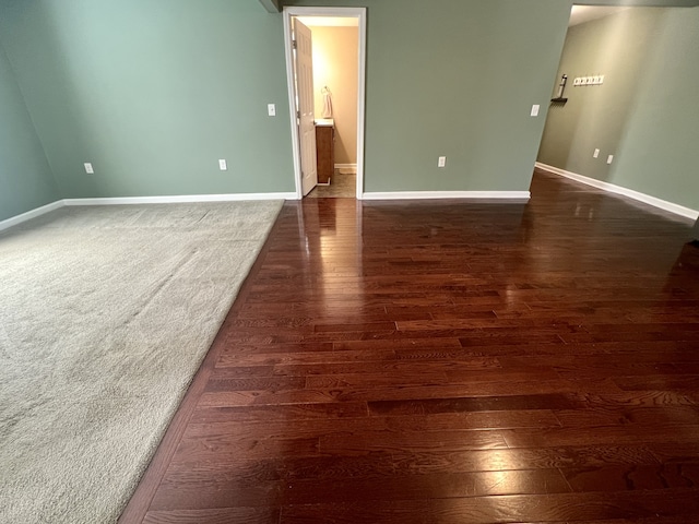 unfurnished room with dark hardwood / wood-style floors