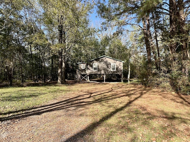 1518 Matlock Dr, Chapmansboro, TN 37035 - view of green lawn with a carport and stairs
