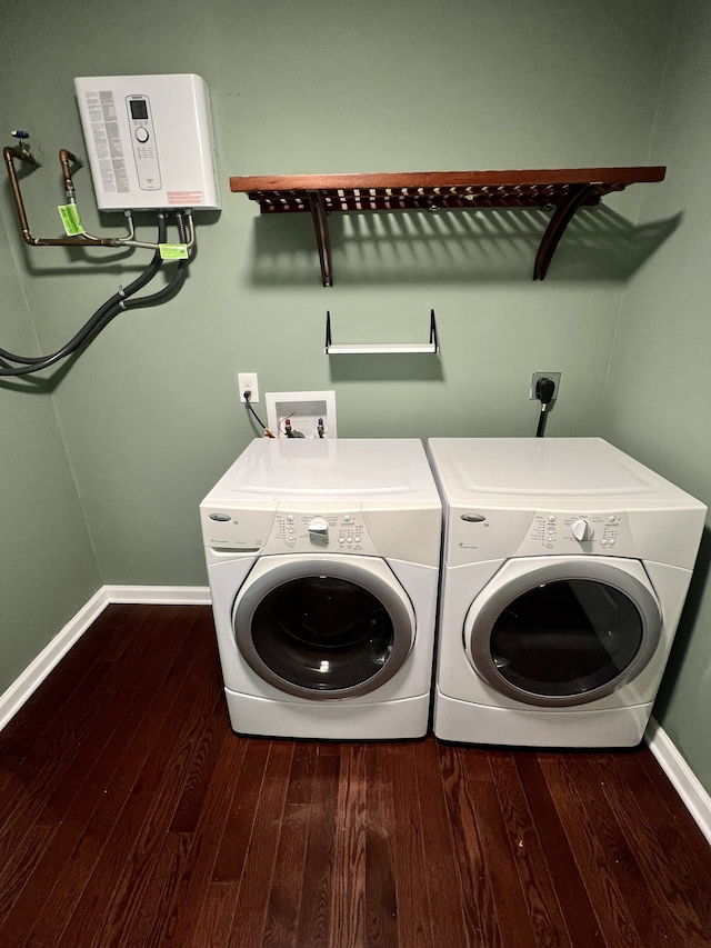 washroom with washing machine and dryer and dark wood-type flooring