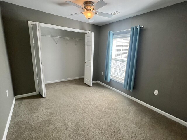 1518 Matlock Dr, Chapmansboro, TN 37035 - unfurnished bedroom featuring carpet flooring, baseboards, a closet, and ceiling fan