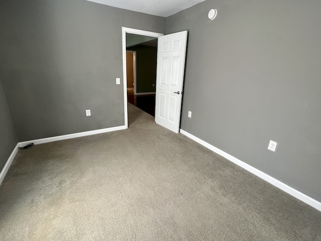 spare room with carpet floors