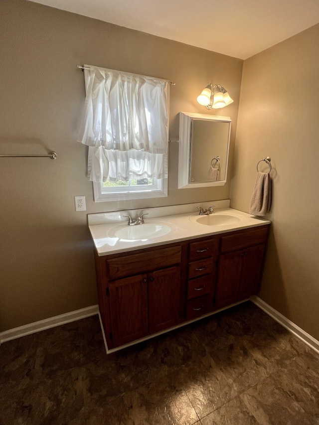 1518 Matlock Dr, Chapmansboro, TN 37035 - bathroom featuring double vanity and baseboards