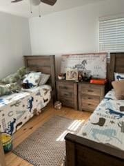 bedroom featuring ceiling fan and light hardwood / wood-style flooring