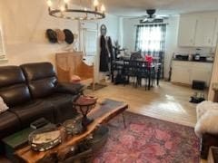 living room with an inviting chandelier