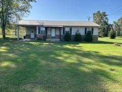 ranch-style house featuring a front lawn