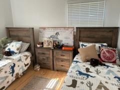 bedroom with hardwood / wood-style floors