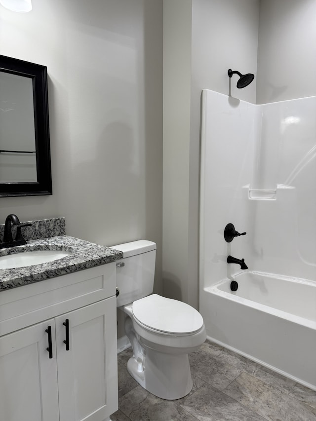 full bathroom with vanity, bathing tub / shower combination, and toilet