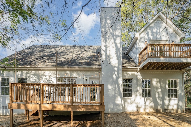 back of house featuring a deck