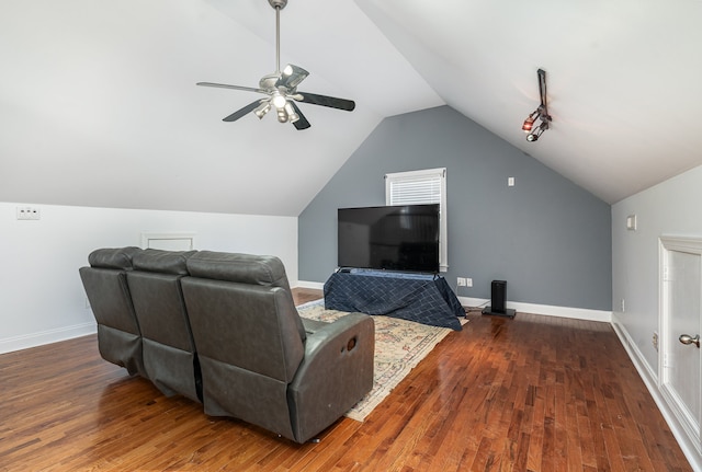 interior space featuring dark hardwood / wood-style floors, vaulted ceiling, and ceiling fan