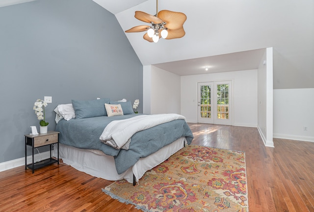 bedroom with ceiling fan, hardwood / wood-style flooring, french doors, and vaulted ceiling