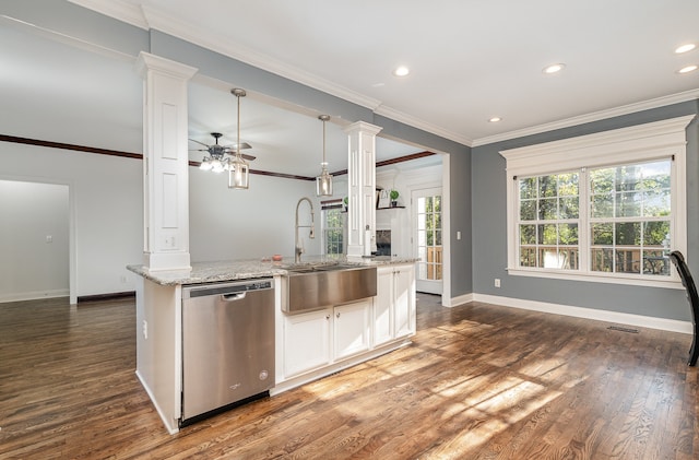 kitchen featuring a center island with sink, a wealth of natural light, dark hardwood / wood-style floors, and dishwasher