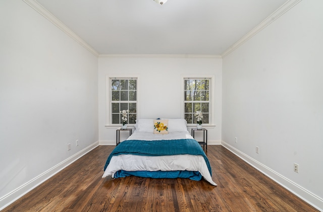 bedroom featuring ornamental molding and dark hardwood / wood-style floors