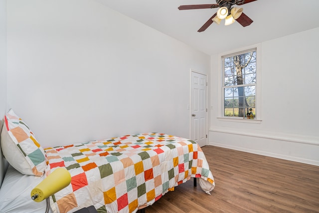 bedroom featuring ceiling fan and dark hardwood / wood-style floors