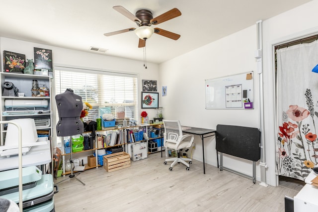 office area with ceiling fan and light wood-type flooring