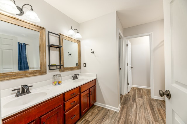 bathroom with vanity and hardwood / wood-style flooring