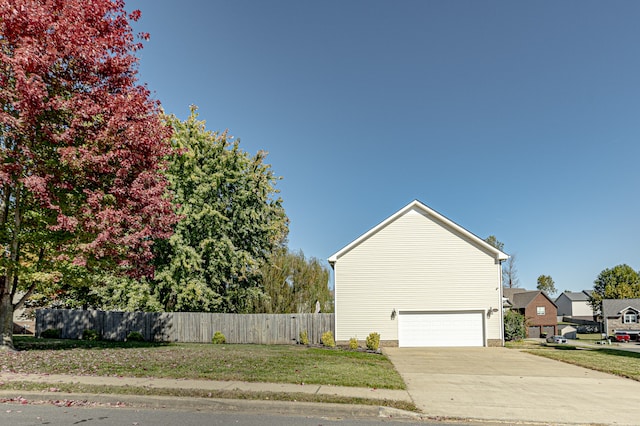 view of side of property featuring a garage