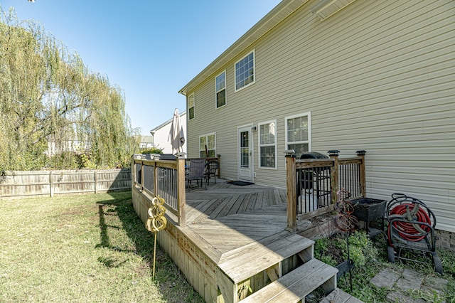 wooden terrace with a yard