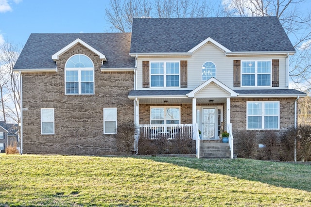 view of front of property featuring a front lawn and covered porch