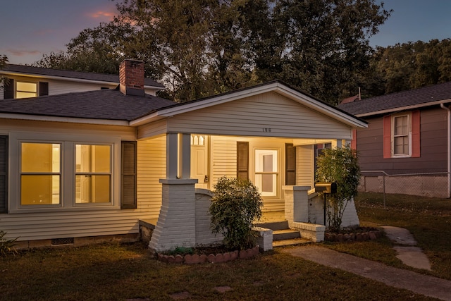 view of front of home featuring a yard