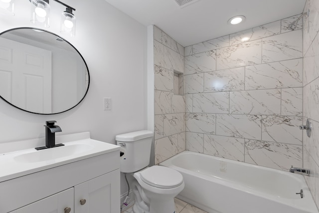 full bathroom with tiled shower / bath, vanity, and toilet