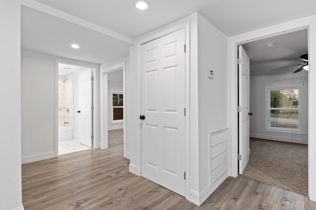 hallway with light wood-type flooring