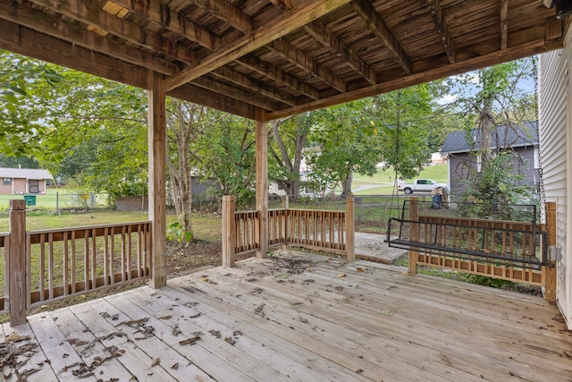 wooden deck with a lawn