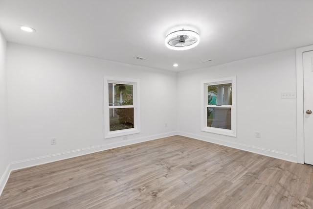 unfurnished room with ceiling fan and light hardwood / wood-style floors