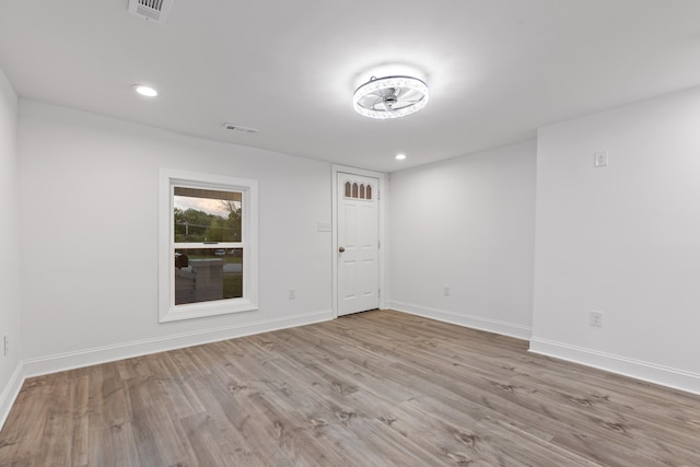 unfurnished room featuring light hardwood / wood-style flooring