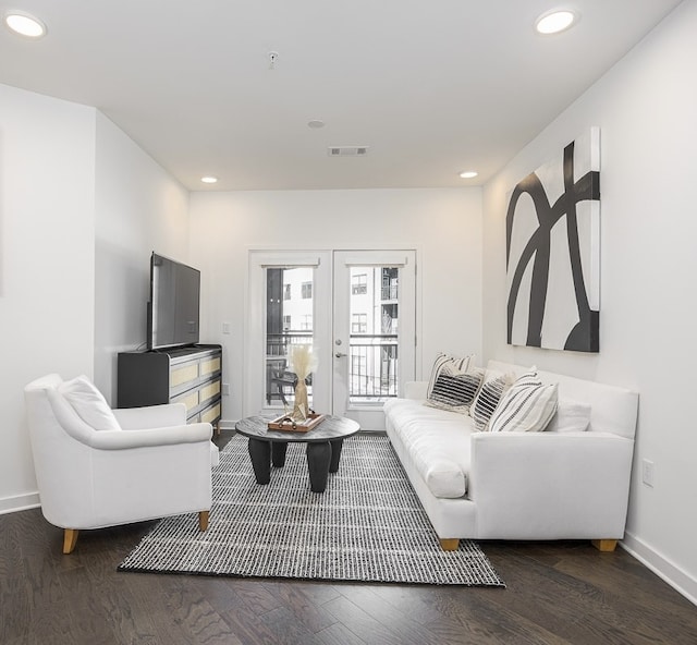 living room with french doors and dark hardwood / wood-style flooring