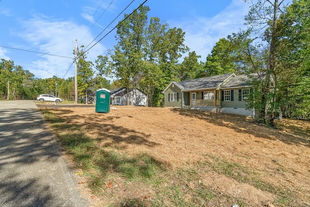 view of yard featuring covered porch