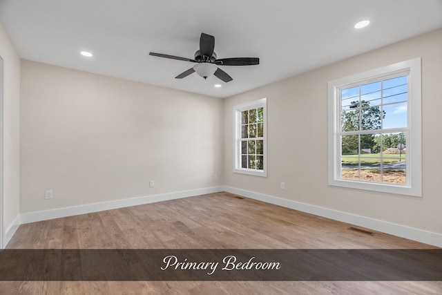 unfurnished room with ceiling fan and light hardwood / wood-style floors