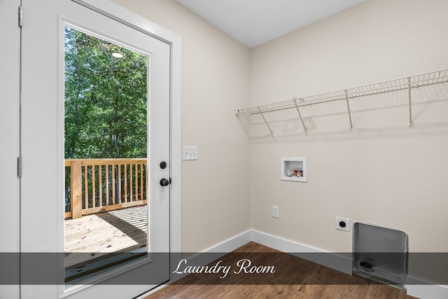 clothes washing area featuring washer hookup, hookup for an electric dryer, and dark hardwood / wood-style floors