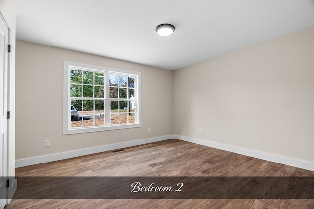 unfurnished room featuring light hardwood / wood-style floors