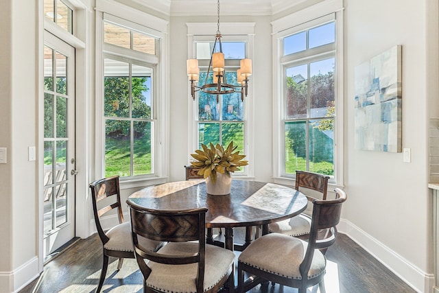 sunroom / solarium featuring an inviting chandelier and a healthy amount of sunlight