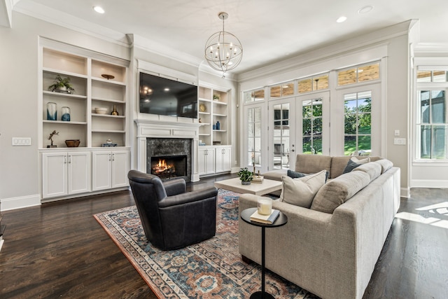 living room with a high end fireplace, crown molding, and dark hardwood / wood-style flooring