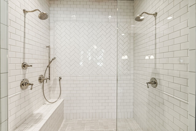 bathroom with a shower with shower door