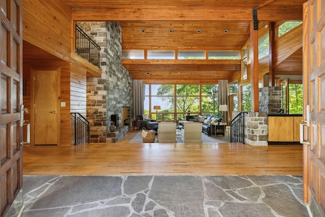 109 Jocelyn Hills Dr, Nashville, TN 37205 - interior space featuring wooden walls, a fireplace, wood finished floors, a towering ceiling, and stairway