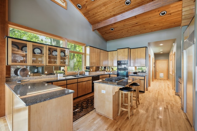 kitchen featuring a center island, high vaulted ceiling, light hardwood / wood-style flooring, wooden ceiling, and beamed ceiling