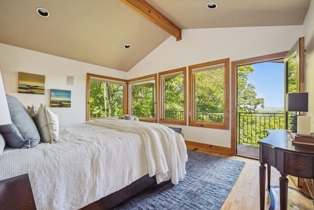 bedroom featuring access to exterior, light wood-type flooring, multiple windows, and vaulted ceiling with beams