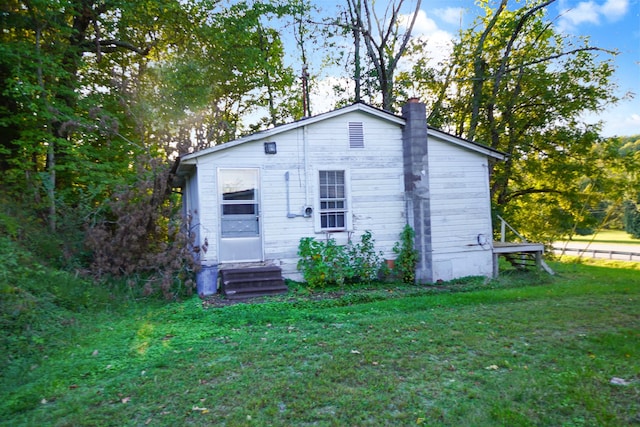 back of house with a yard