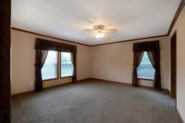 carpeted empty room with crown molding and ceiling fan