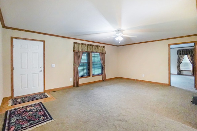 unfurnished living room featuring ornamental molding, plenty of natural light, and carpet floors