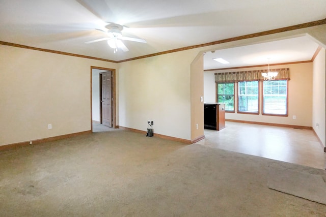 unfurnished room featuring crown molding, light colored carpet, and ceiling fan with notable chandelier