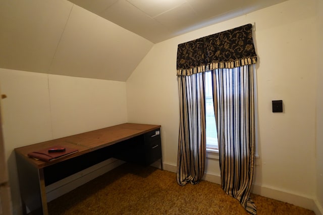 bonus room with vaulted ceiling and carpet flooring